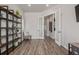 Well-appointed home office featuring hard surface floors, stylish bookshelf, and French doors leading to the hallway at 3256 Offbeaten Pl, Castle Rock, CO 80108