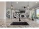 Gourmet kitchen with granite counters, stainless steel appliances, and view to the living room at 3256 Offbeaten Pl, Castle Rock, CO 80108
