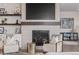Cozy living room with a fireplace, comfortable seating, and elegant decor creating a relaxing atmosphere at 3256 Offbeaten Pl, Castle Rock, CO 80108