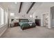 Spacious main bedroom boasts a vaulted ceiling, wood beams, and a luxurious, relaxing atmosphere at 3256 Offbeaten Pl, Castle Rock, CO 80108