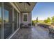 An outdoor kitchen and bar area with views of the large backyard and beautiful blue skies at 3256 Offbeaten Pl, Castle Rock, CO 80108