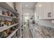 Open pantry featuring shelving, countertops and natural light from the adjacent breakfast nook at 3256 Offbeaten Pl, Castle Rock, CO 80108