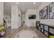 Open playroom with a playful alphabet rug, wall-mounted TV, and custom storage, perfect for  at 3256 Offbeaten Pl, Castle Rock, CO 80108