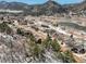Scenic aerial view of neighborhood with houses and a beautiful mountain backdrop at 113 Oakdale Dr, Palmer Lake, CO 80133