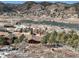 Aerial view of home in a beautiful mountain town with lake views, perfect for a serene lifestyle at 113 Oakdale Dr, Palmer Lake, CO 80133