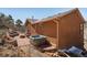 Wonderful backyard with a patio, hot tub, and plenty of room for entertaining at 113 Oakdale Dr, Palmer Lake, CO 80133