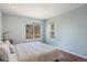 Bedroom features a light blue wall paint, hard wood floors and mountain views from the window at 113 Oakdale Dr, Palmer Lake, CO 80133