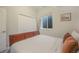 Cozy bedroom with a window and white walls and carpet, a full-sized bed, and a double door closet at 113 Oakdale Dr, Palmer Lake, CO 80133