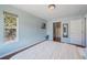 Bright bedroom with hard wood floors and a window with a wooded view at 113 Oakdale Dr, Palmer Lake, CO 80133