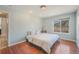 Bright bedroom featuring a light blue wall paint, hard wood floors and view of the mountains at 113 Oakdale Dr, Palmer Lake, CO 80133