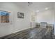 Open room features wood floors, recessed lighting, and a window with a mountain view at 113 Oakdale Dr, Palmer Lake, CO 80133