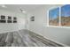 Bright bonus room features wood floors, a view of the mountains, and recessed lighting at 113 Oakdale Dr, Palmer Lake, CO 80133