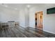 Open room features wood floors, recessed lighting, and custom shelving with baskets at 113 Oakdale Dr, Palmer Lake, CO 80133