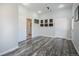 Versatile bonus room with wood floors, recessed lighting, and multiple entryways at 113 Oakdale Dr, Palmer Lake, CO 80133