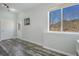 Bright room features wood floors, a view of the mountains, and a projector at 113 Oakdale Dr, Palmer Lake, CO 80133