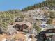 View of the house and wooded surroundings at 113 Oakdale Dr, Palmer Lake, CO 80133