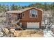 Two story home with attached garage and mountain views at 113 Oakdale Dr, Palmer Lake, CO 80133