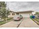 Charming home featuring a mature tree, inviting curb appeal, and an attached two-car garage at 6132 S Grant St, Centennial, CO 80121