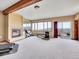 Spacious bonus room featuring fireplace, large windows with scenic views, and workout equipment at 260 Dekker Dr, Golden, CO 80401