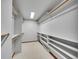 Walk-in closet featuring built-in shelving and hanging rods for organized storage at 260 Dekker Dr, Golden, CO 80401