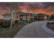 Beautiful home featuring a circular driveway and manicured front yard at sunset at 260 Dekker Dr, Golden, CO 80401