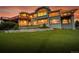 Impressive home with a terraced lawn, stone accents, large windows, and outdoor balcony at 260 Dekker Dr, Golden, CO 80401