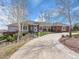 Inviting single-story home features a wide driveway, meticulous landscaping and a charming walkway at 260 Dekker Dr, Golden, CO 80401