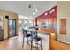 Bright kitchen featuring a large island, bar seating, wood cabinets, and stainless appliances at 260 Dekker Dr, Golden, CO 80401
