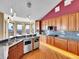 Chef's kitchen featuring stainless appliances, granite counters, wood cabinets, and counter seating at 260 Dekker Dr, Golden, CO 80401