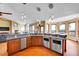 Open kitchen with stainless appliances, an island and a breakfast nook featuring panoramic views at 260 Dekker Dr, Golden, CO 80401