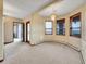Open living room with scenic views, chandelier, and neutral carpet at 260 Dekker Dr, Golden, CO 80401