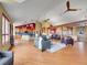 Open concept living area showcasing wood floors, beam details and a modern kitchen at 260 Dekker Dr, Golden, CO 80401