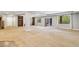 Large basement space boasting built-in shelving and a sliding glass door to the backyard at 6085 Nile Cir, Golden, CO 80403