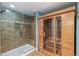 Luxurious bathroom featuring a glass-enclosed shower and a sauna for relaxation at 6085 Nile Cir, Golden, CO 80403
