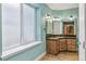 Well-lit bathroom with tile floors, a granite countertop, and a built-in sauna at 6085 Nile Cir, Golden, CO 80403