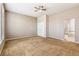 Spacious bedroom boasts neutral tones, plush carpeting, and a bathroom with a separate tub and shower at 6085 Nile Cir, Golden, CO 80403