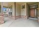 Inviting front porch showcases brick accents and a charming entrance to the home at 6085 Nile Cir, Golden, CO 80403