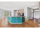 Open-concept kitchen featuring an island with granite countertops and modern appliances at 6085 Nile Cir, Golden, CO 80403