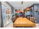 Elegant dining area with hardwood floors and a sliding door to the backyard at 5570 Nepal St, Denver, CO 80249