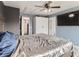 The main bedroom features an attached closet and a ceiling fan, providing comfort and storage at 5570 Nepal St, Denver, CO 80249