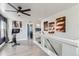 An upstairs landing with exercise equipment, a modern staircase, and unique American flag art at 5570 Nepal St, Denver, CO 80249