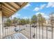 Balcony offers a view of parking and neighborhood trees, providing a peaceful outdoor space for relaxing and enjoying the scenery at 12191 Melody Dr # 301, Westminster, CO 80234