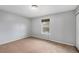 Neutral bedroom has ample natural light, a neutral color scheme, and plush carpeting for a relaxing atmosphere at 12191 Melody Dr # 301, Westminster, CO 80234