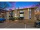 Charming condominium building featuring multiple balconies with black metal railings and a well-maintained lawn at 12191 Melody Dr # 301, Westminster, CO 80234