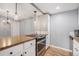 Well-appointed kitchen with stainless appliances, granite countertops and wood flooring at 12191 Melody Dr # 301, Westminster, CO 80234