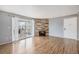 Inviting living room featuring wood floors, a cozy fireplace, and a sliding glass door leading to the outside at 12191 Melody Dr # 301, Westminster, CO 80234