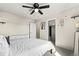 Neutral toned bedroom showcases a ceiling fan and convenient closet access at 244 Chipeta Way, Lochbuie, CO 80603