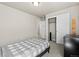 A tidy bedroom features closet space and a neutral color scheme at 244 Chipeta Way, Lochbuie, CO 80603