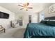 A cozy bedroom setup with carpeting, TV and comfortable arm chairs at 244 Chipeta Way, Lochbuie, CO 80603