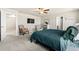 A primary bedroom includes an adjacent seating area and neutral carpeting at 244 Chipeta Way, Lochbuie, CO 80603